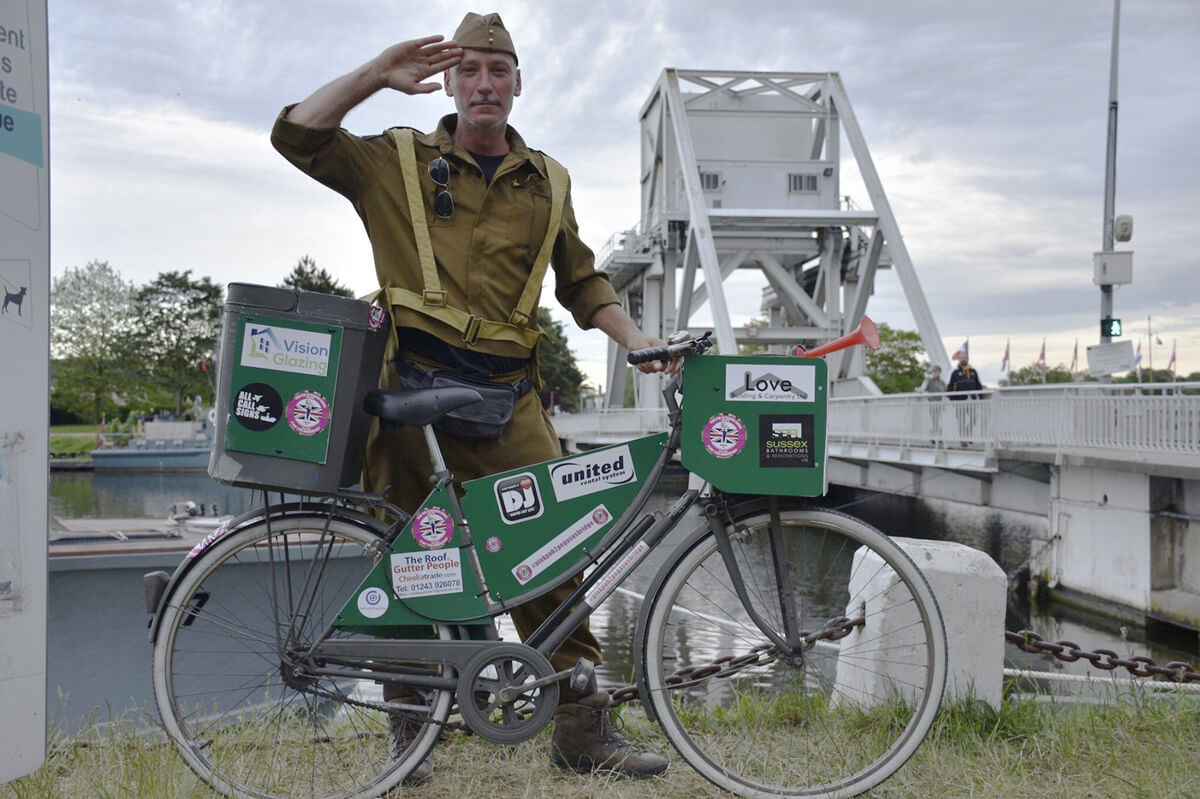 A member of the BMVS team getting into character on his way to Normandy.